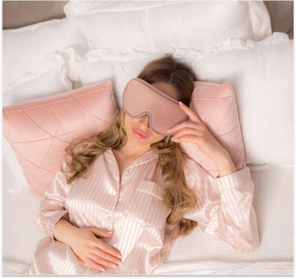 Sleeping with dark pink mask